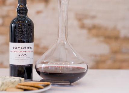 An image of a bottle of wine and a plate of food, Port Masterclass. The London Wine Academy